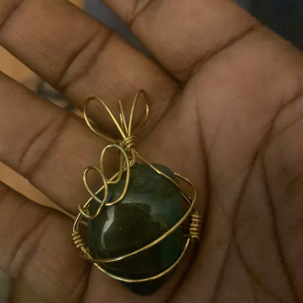 Beautiful olive deep green statement pendant with gold swirl wire